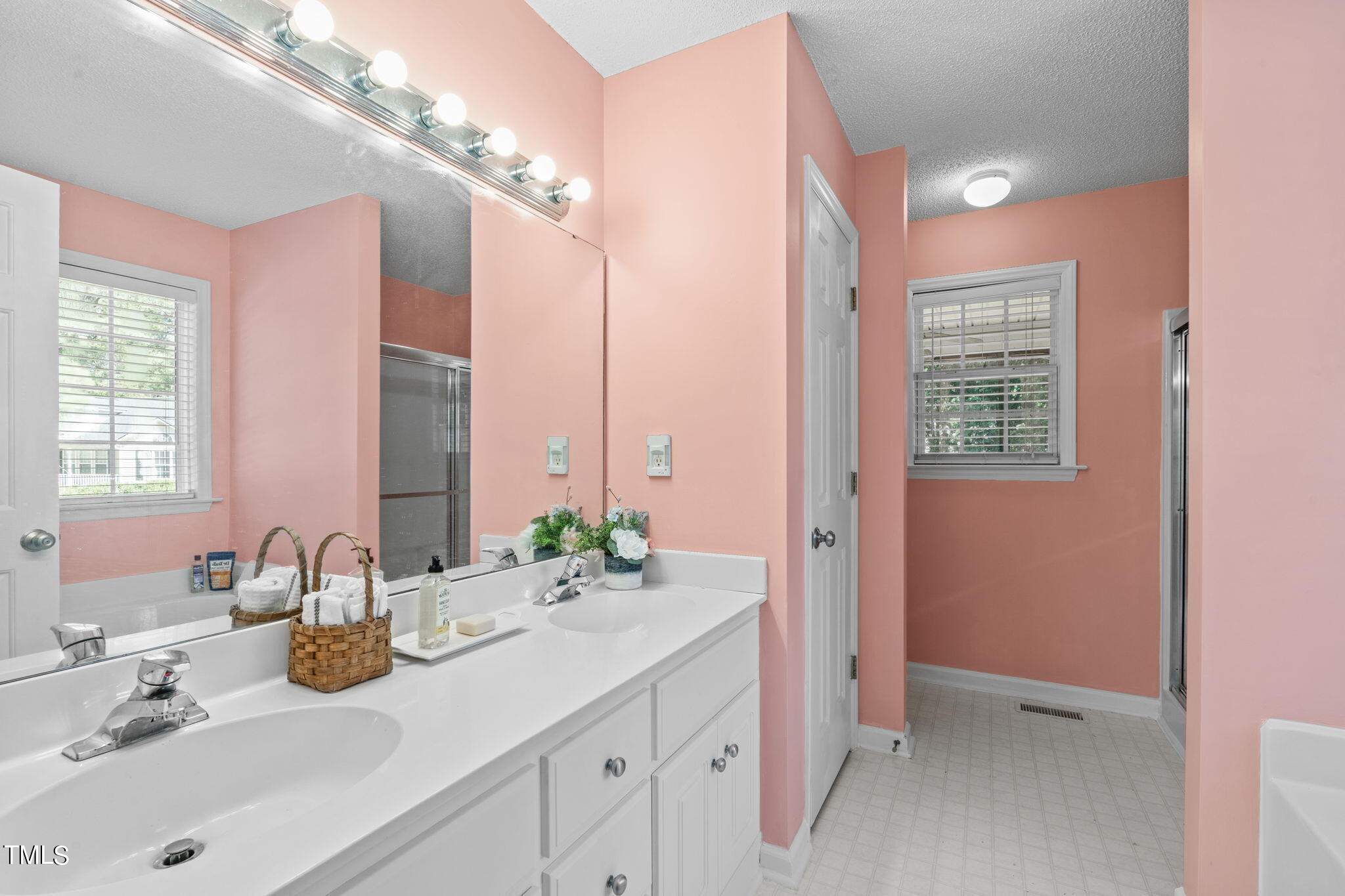 128 Edmondson Drive Willow Spring, NC 27592 - Photo 20 of 38 a bathroom with a sink double vanity and a mirror