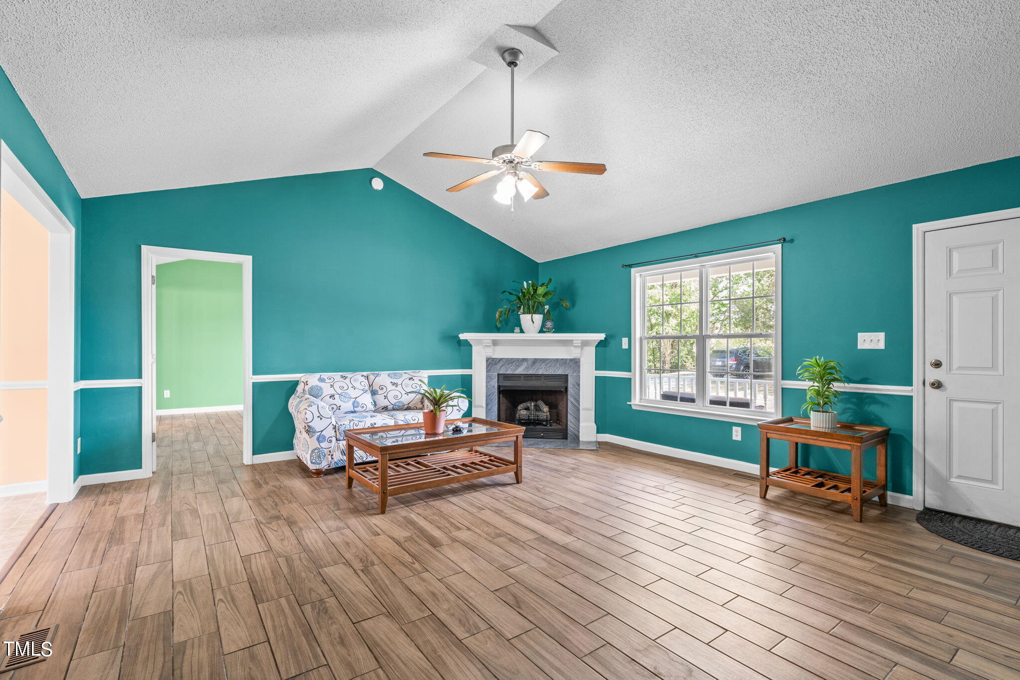 128 Edmondson Drive Willow Spring, NC 27592 - Photo 2 of 38 a living room with furniture and a fireplace