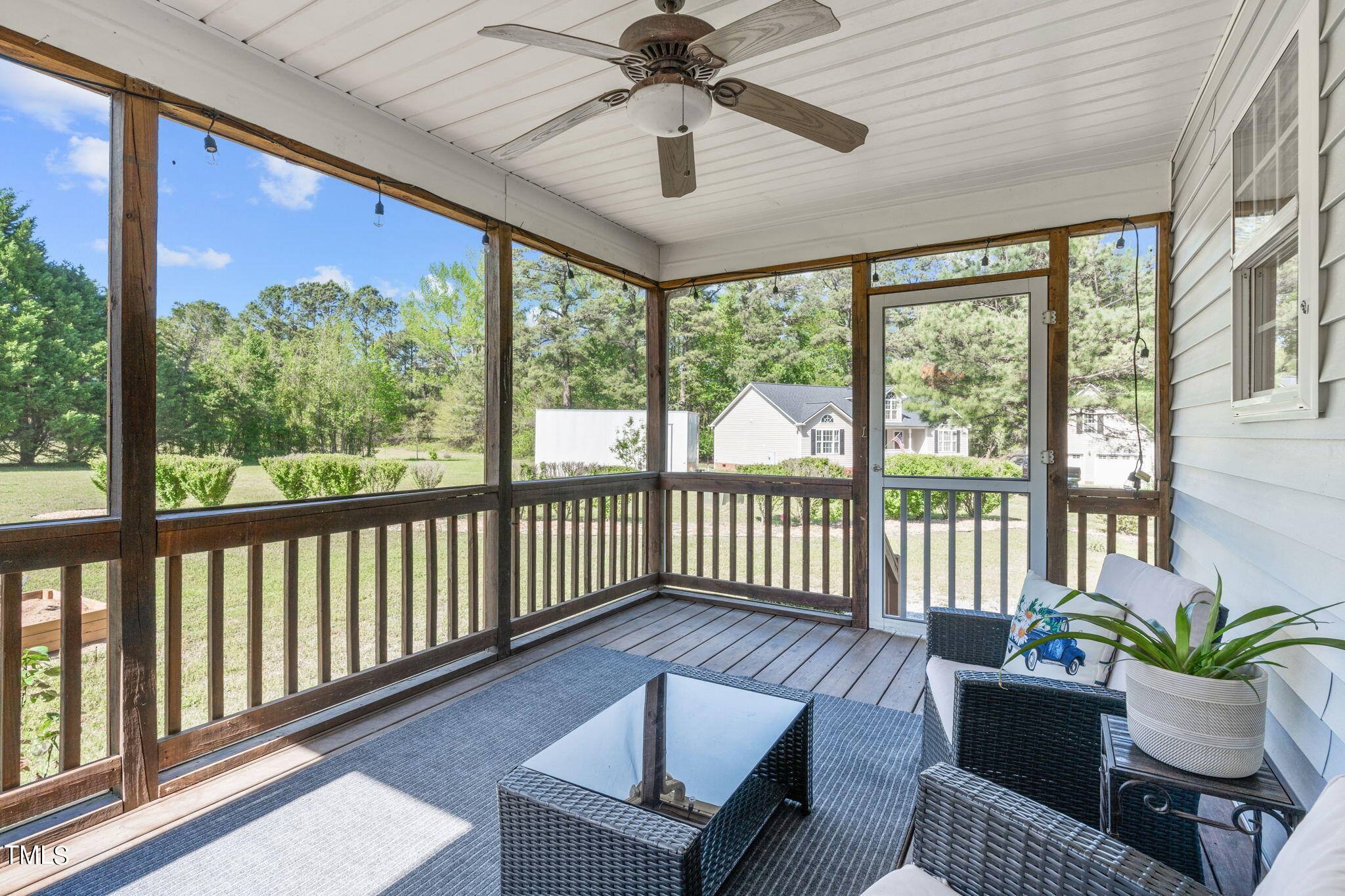 128 Edmondson Drive Willow Spring, NC 27592 - Photo 27 of 38 a living room with furniture and a large window