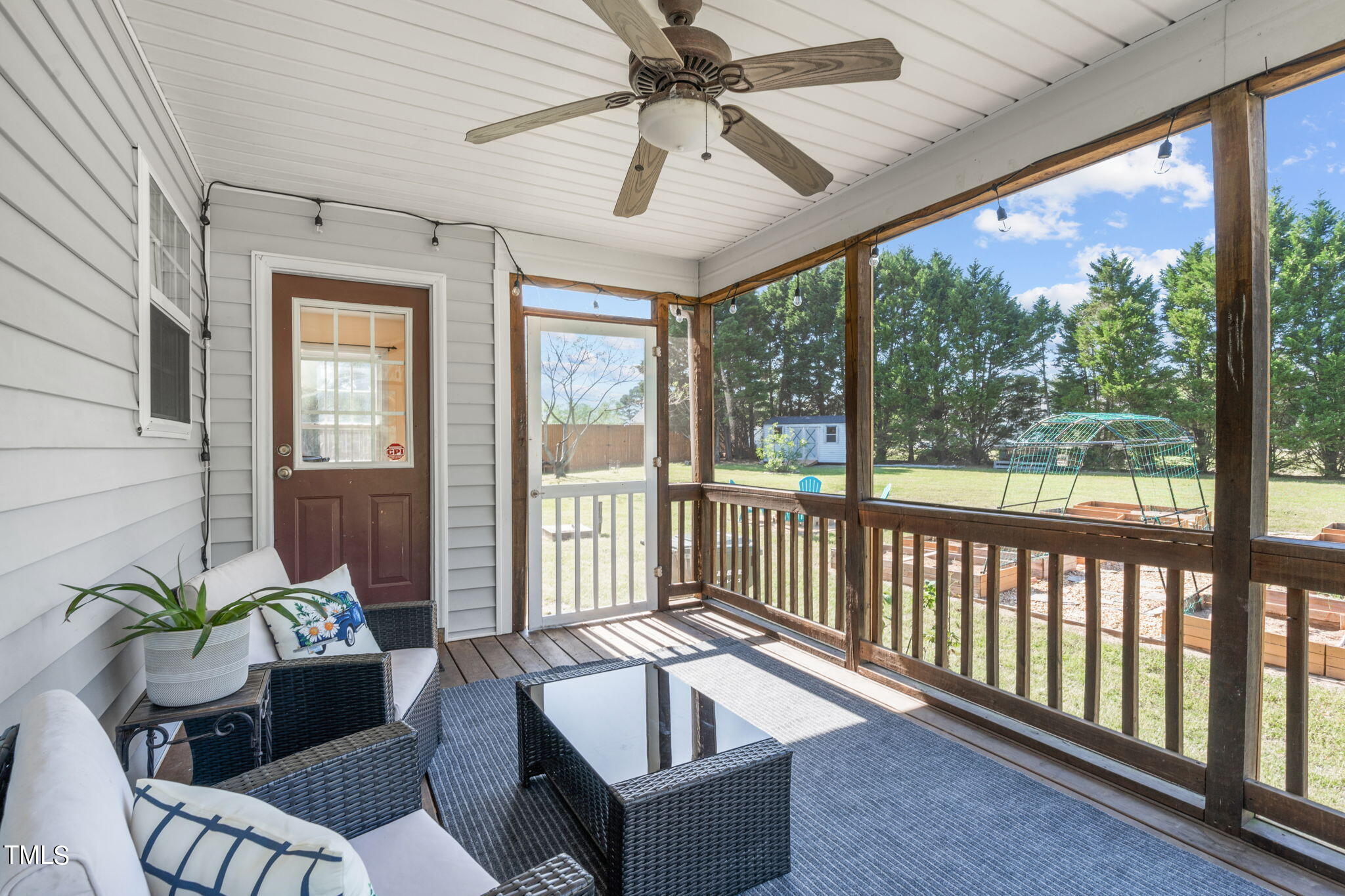 128 Edmondson Drive Willow Spring, NC 27592 - Photo 28 of 38 a living room with furniture and a large window