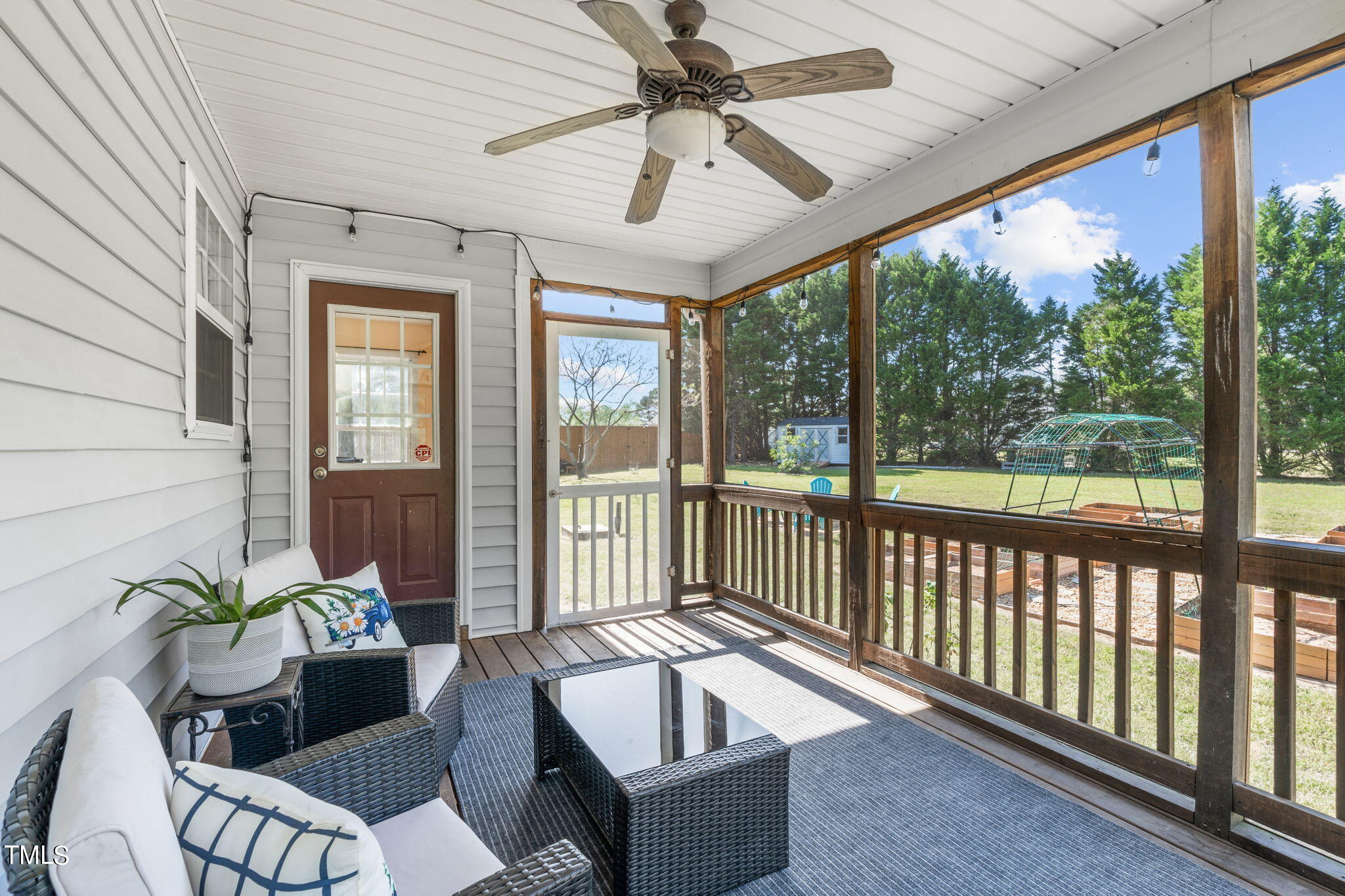128 Edmondson Drive Willow Spring, NC 27592 - Photo 29 of 38 a balcony with furniture and a potted plant