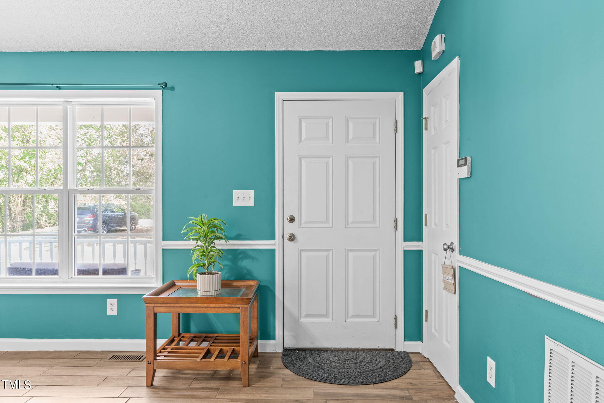 128 Edmondson Drive Willow Spring, NC 27592 - Photo 3 of 38 a room with furniture and a potted plant