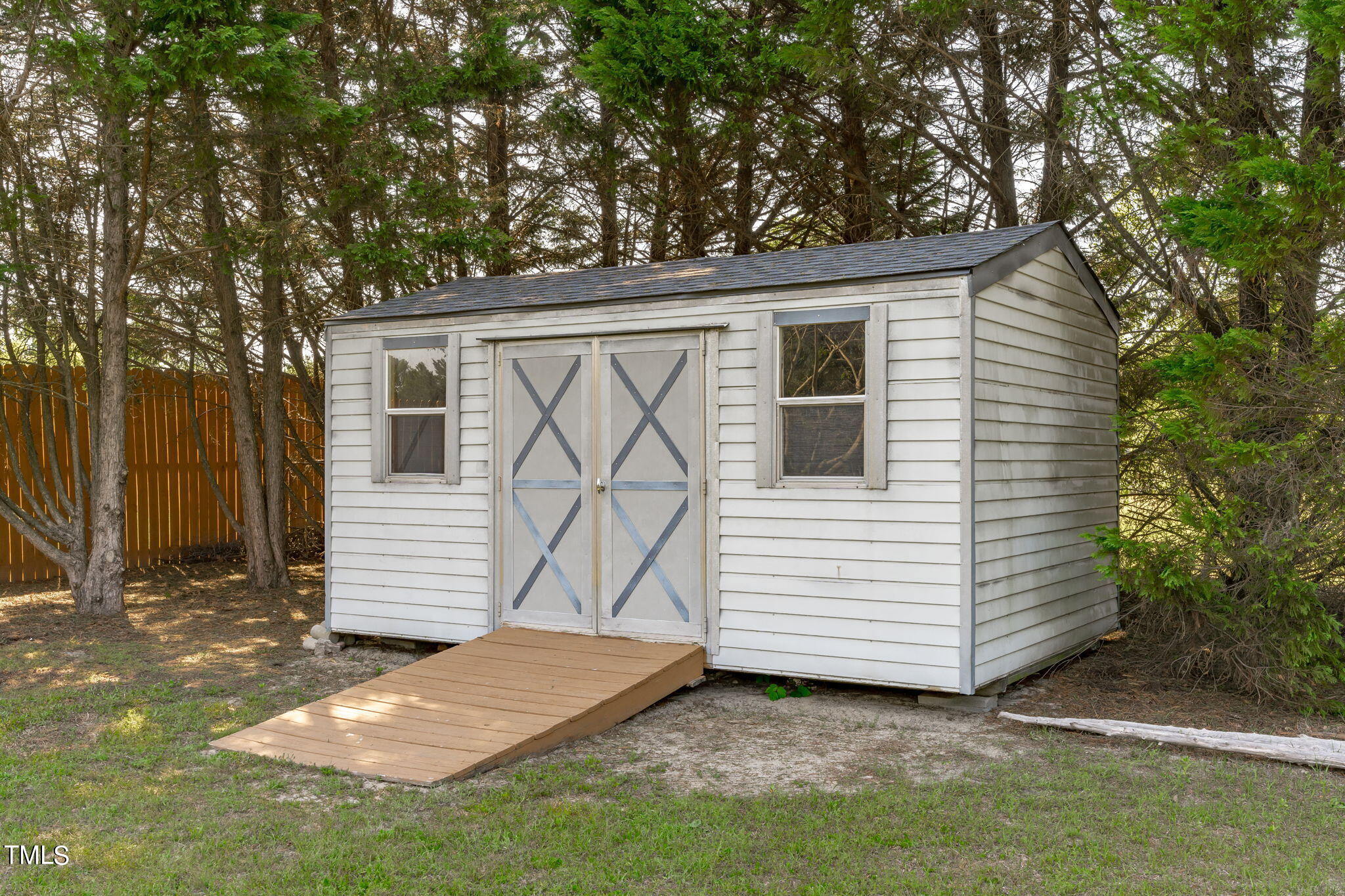 128 Edmondson Drive Willow Spring, NC 27592 - Photo 33 of 38 a view of a white house with a yard and stairs