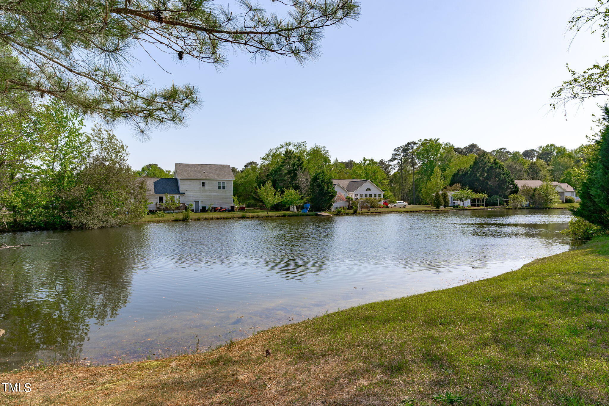 128 Edmondson Drive Willow Spring, NC 27592 - Photo 35 of 38 a view of a lake with houses