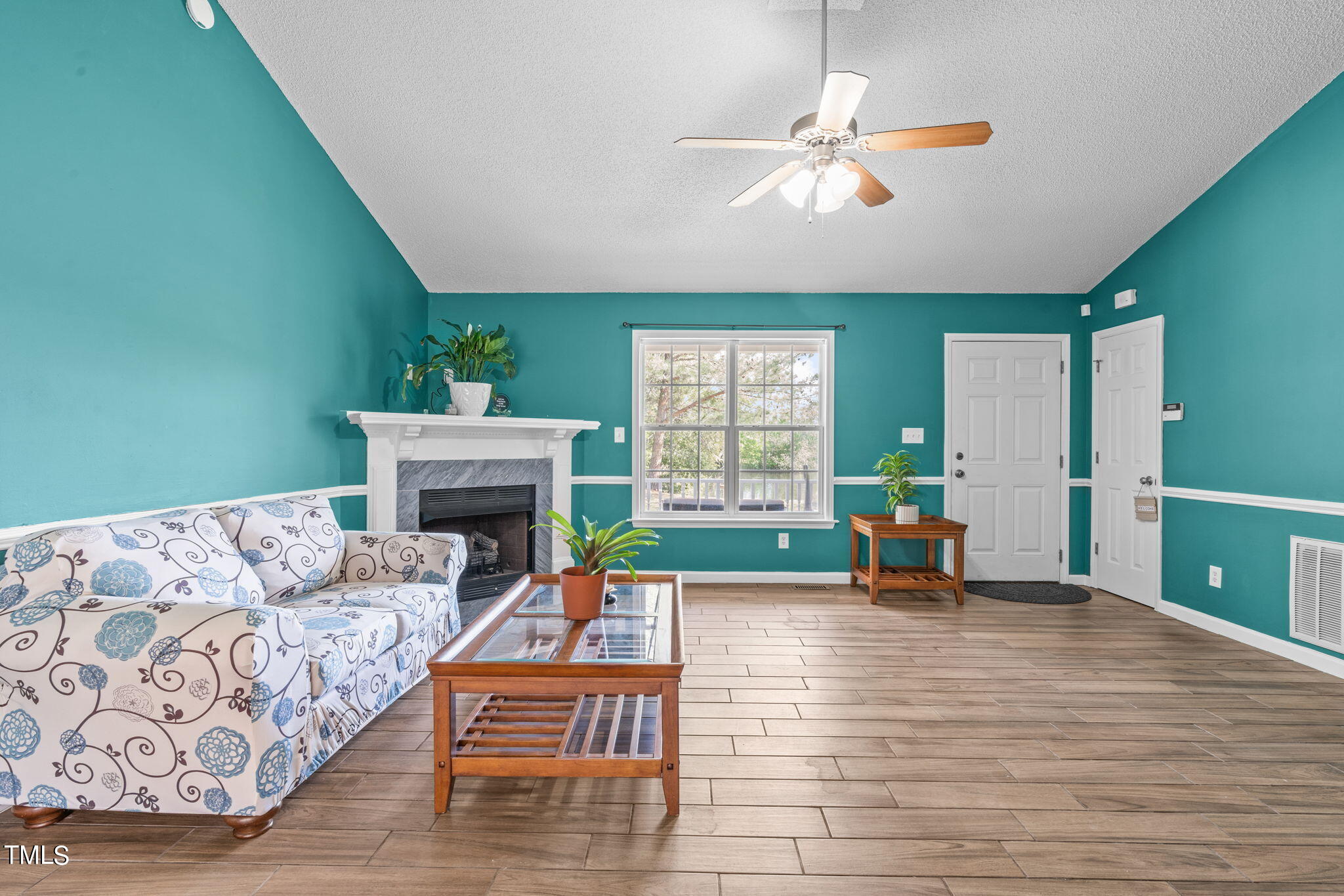 128 Edmondson Drive Willow Spring, NC 27592 - Photo 5 of 38 a living room with furniture and a fireplace