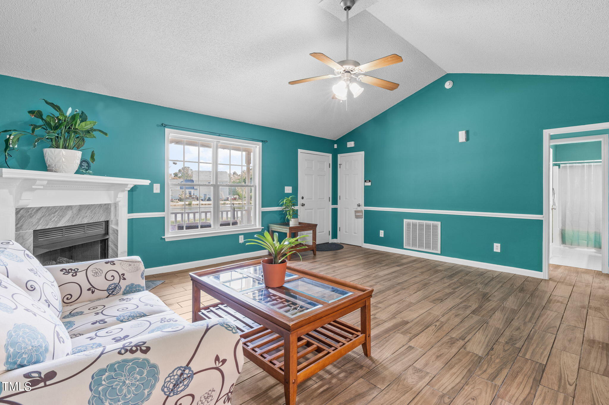 128 Edmondson Drive Willow Spring, NC 27592 - Photo 6 of 38 a living room with furniture and a fireplace