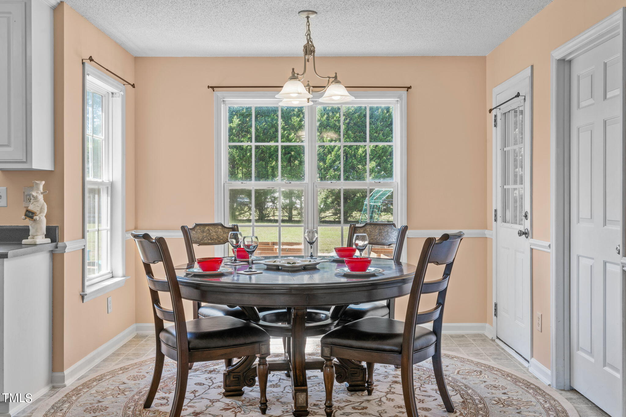 128 Edmondson Drive Willow Spring, NC 27592 - Photo 7 of 38 a view of a dining room with furniture and window