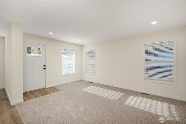 a view of an empty room with a window