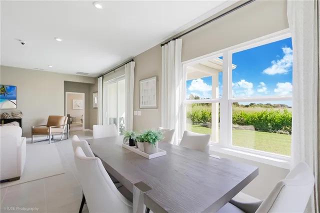 a view of a dining room with furniture window and outside view
