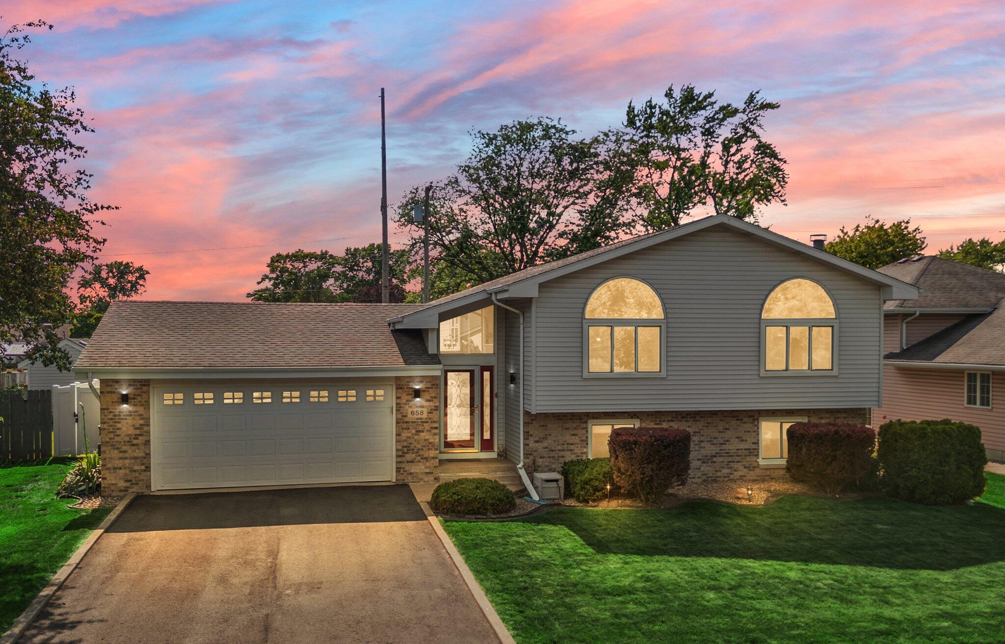 658 Forest Avenue Griffith, IN 46319 - Photo 1 of 31 a front view of a house with a yard
