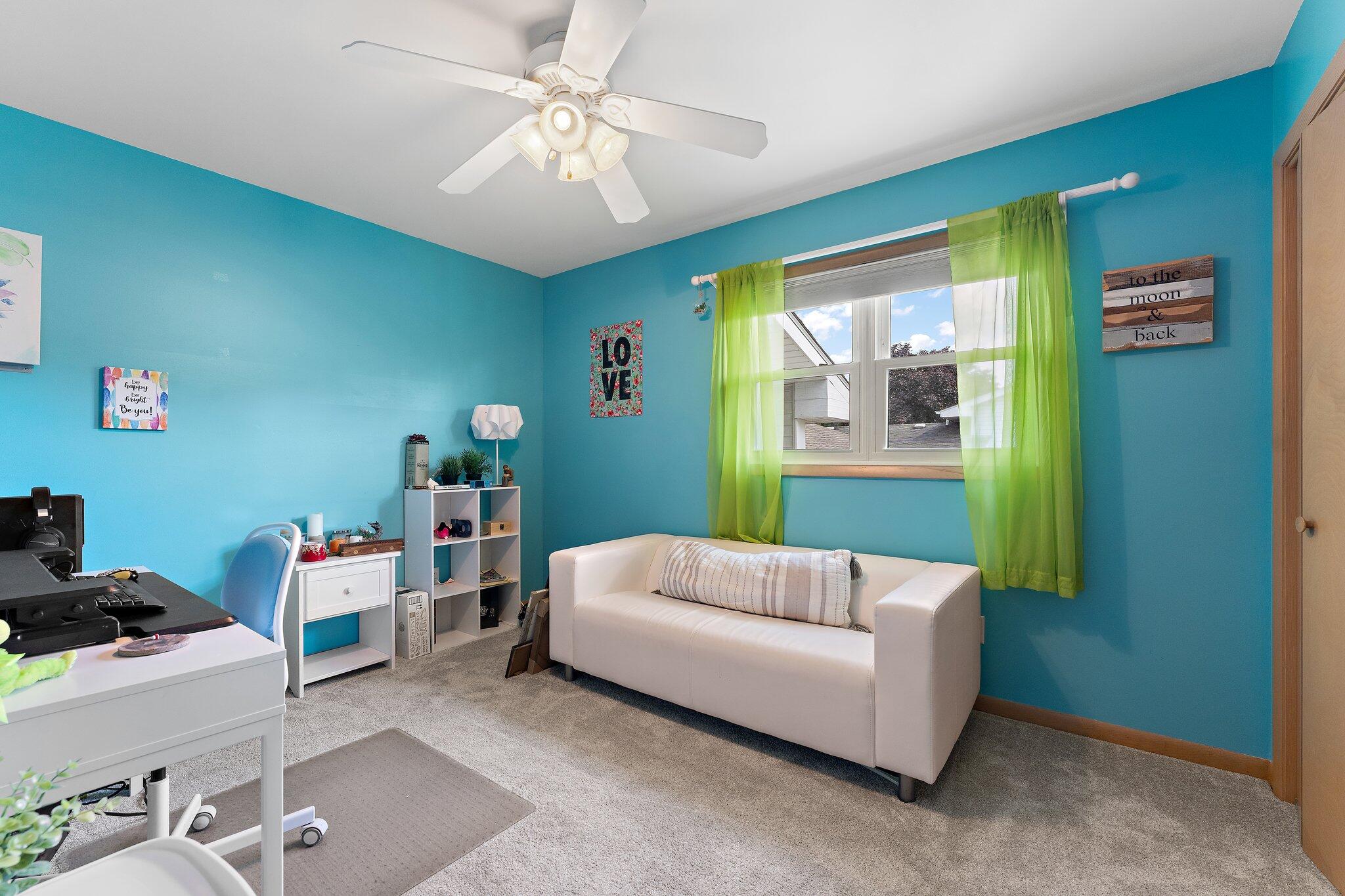 658 Forest Avenue Griffith, IN 46319 - Photo 19 of 31 a living room with furniture and a chandelier