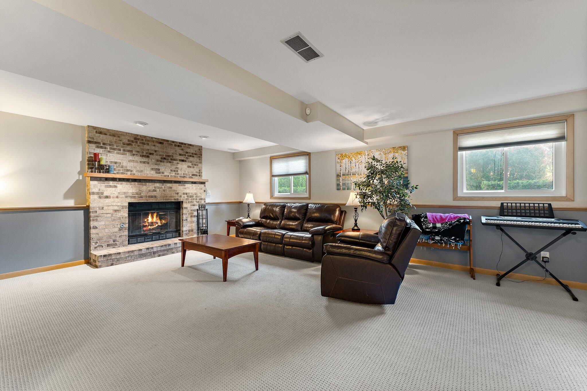 658 Forest Avenue Griffith, IN 46319 - Photo 20 of 31 a living room with furniture and a fireplace