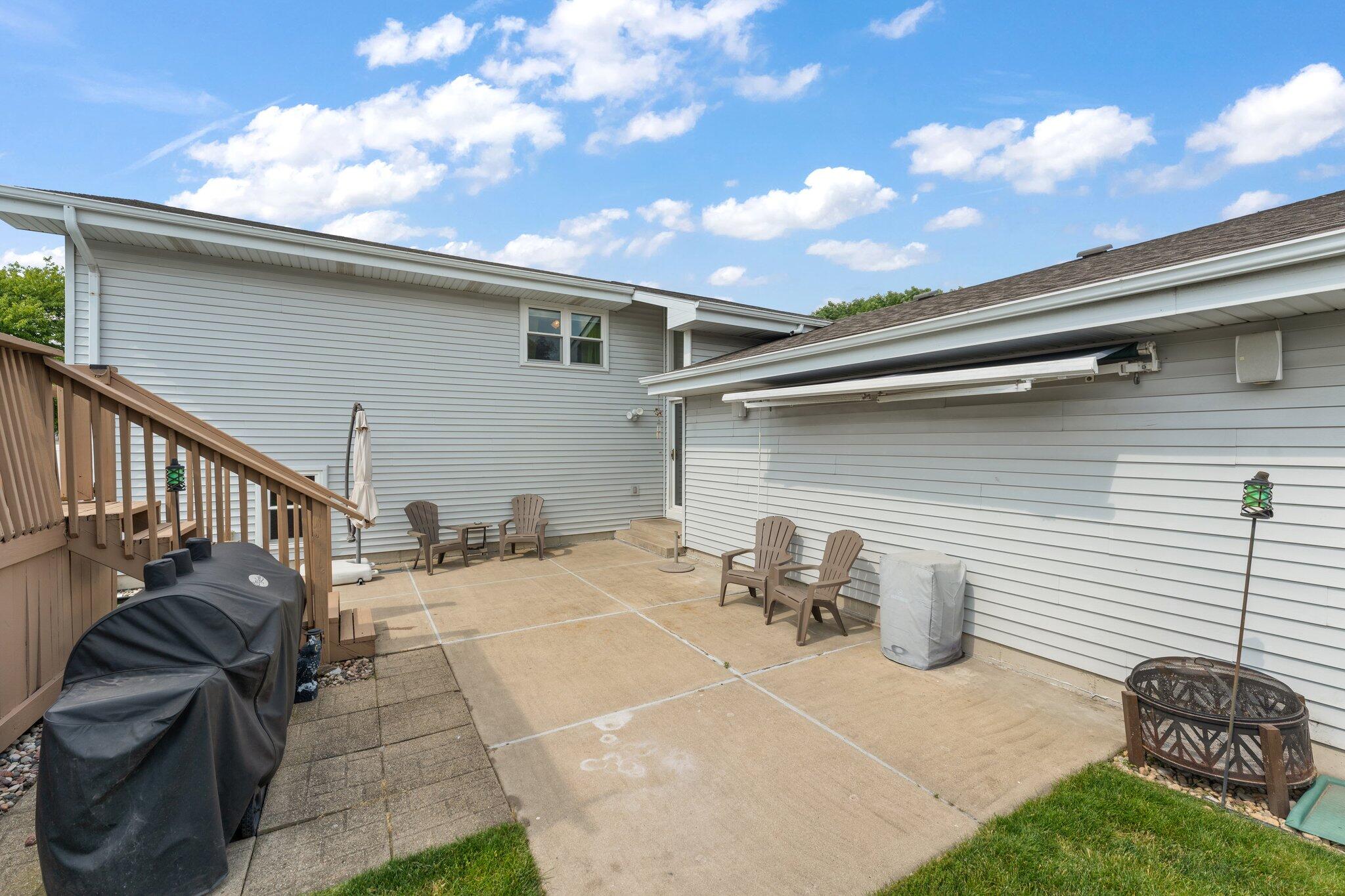 658 Forest Avenue Griffith, IN 46319 - Photo 26 of 31 a view of a patio with table and chairs with wooden fence