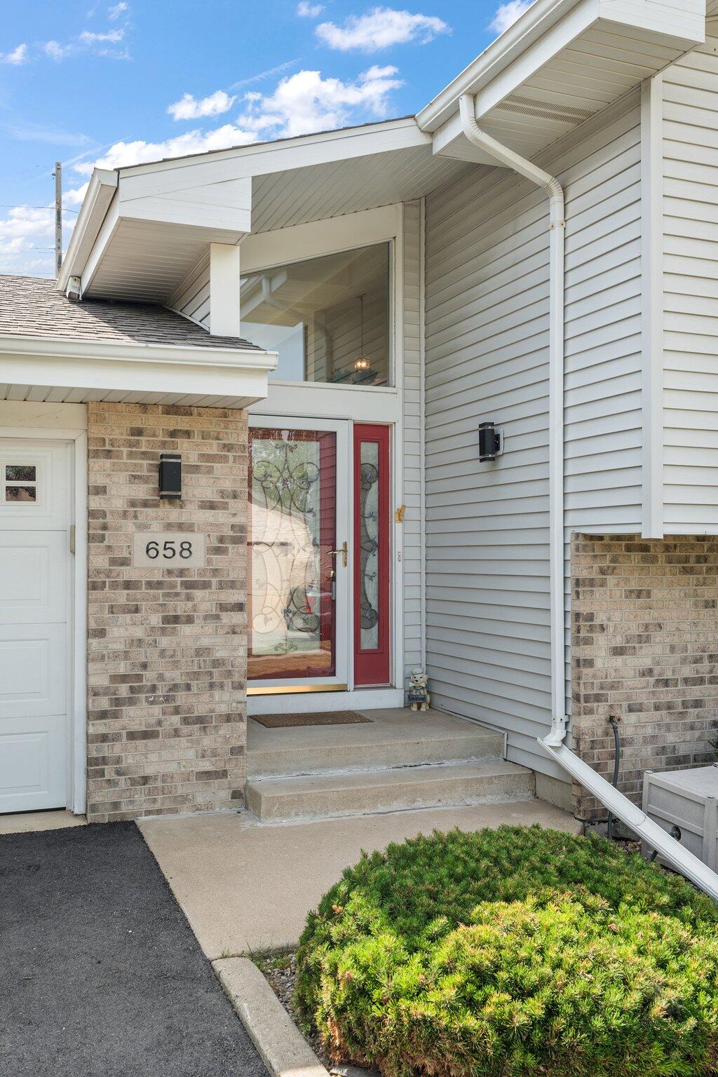 658 Forest Avenue Griffith, IN 46319 - Photo 3 of 31 a view of front door and potted plants