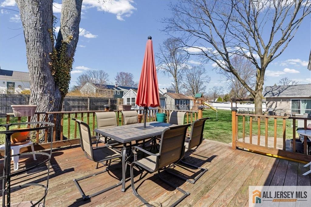 20 Running Brook Road Ewing, NJ 08638 - Photo 20 of 23 a view of a patio with table and chairs with wooden floor and fence