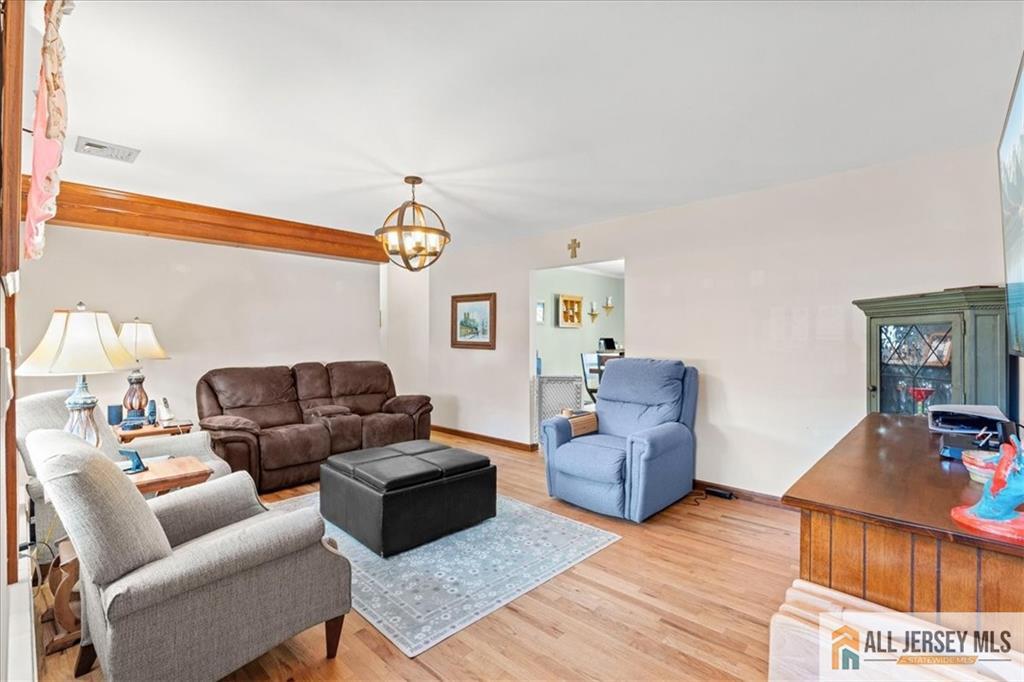 20 Running Brook Road Ewing, NJ 08638 - Photo 4 of 23 a living room with furniture and a flat screen tv
