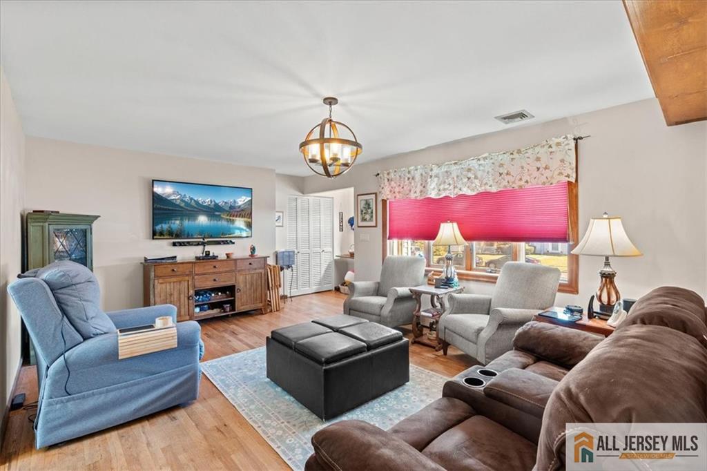 20 Running Brook Road Ewing, NJ 08638 - Photo 6 of 23 a living room with furniture flat screen tv and a large window
