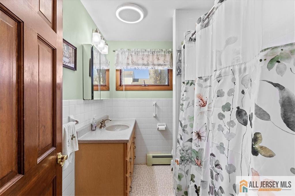 20 Running Brook Road Ewing, NJ 08638 - Photo 7 of 23 a bathroom with a sink and mirror