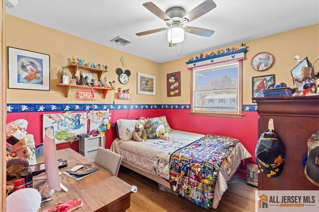 20 Running Brook Road Ewing, NJ 08638 - Photo 8 of 23 a bedroom with a bed and wooden floor