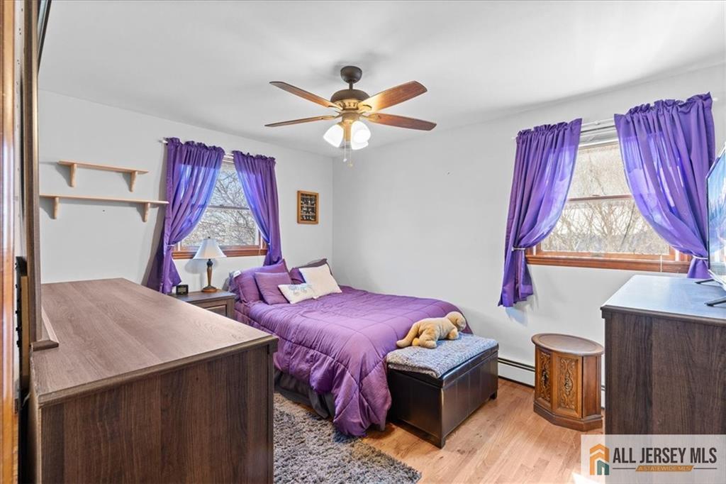 20 Running Brook Road Ewing, NJ 08638 - Photo 10 of 23 a bedroom with a bed and a chandelier