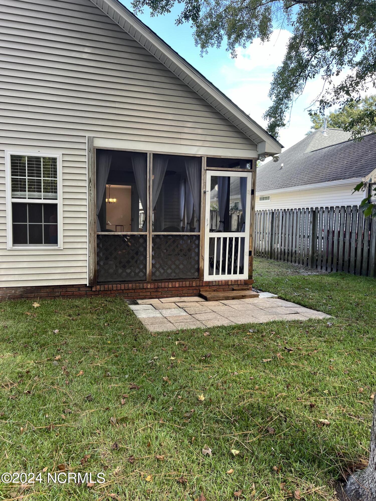 5005 Long Pointe Road Wilmington, NC 28409 - Photo 24 of 29 Rear Exterior to Screened Porch