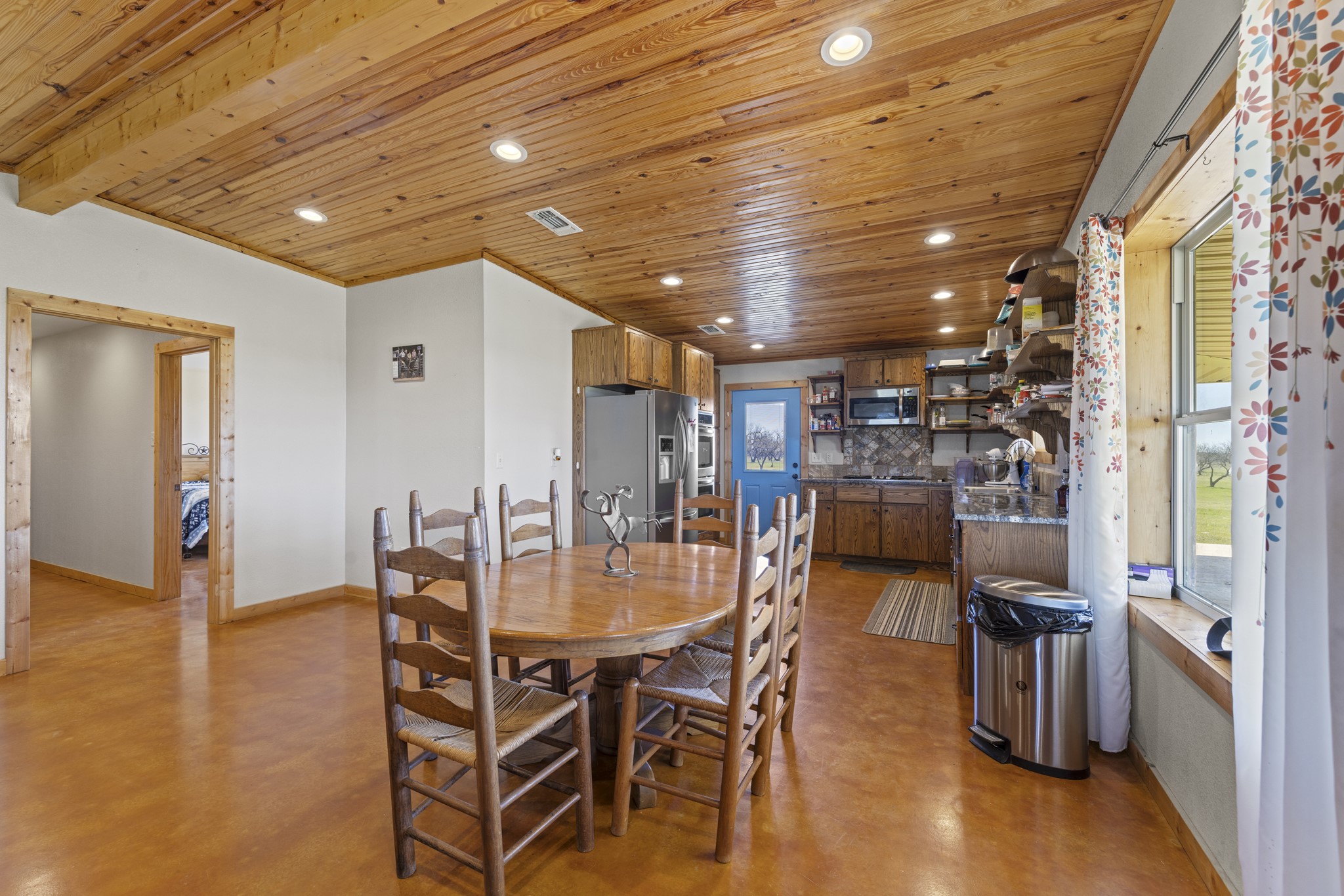 723 Fm 2926 Baird, TX 79504 - Photo 15 of 26 a dining room with furniture and a kitchen view
