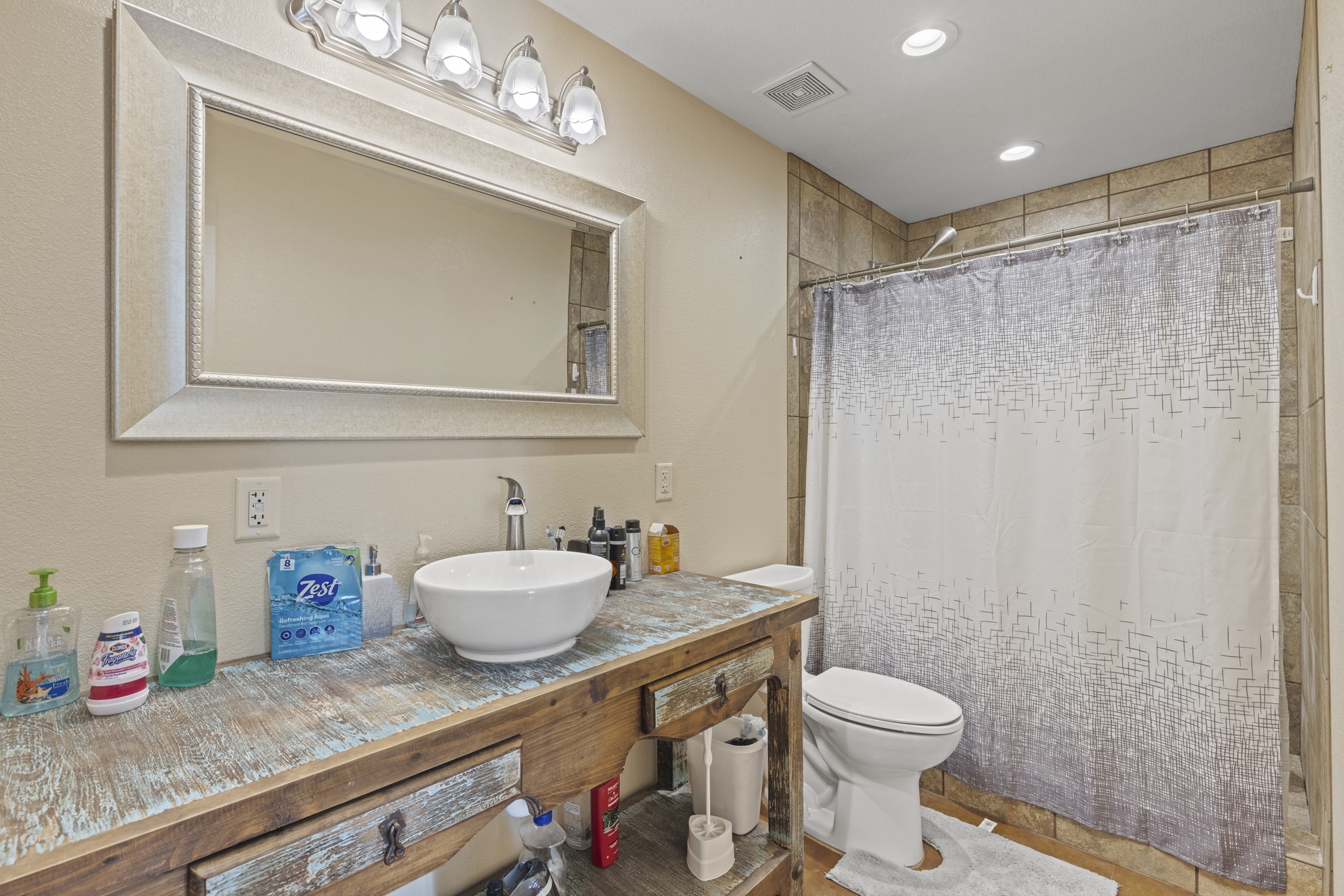 723 Fm 2926 Baird, TX 79504 - Photo 19 of 26 a bathroom with a granite countertop sink a toilet and a mirror