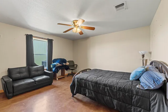 a kitchen with lots of wooden cabinets a sink and dishwasher