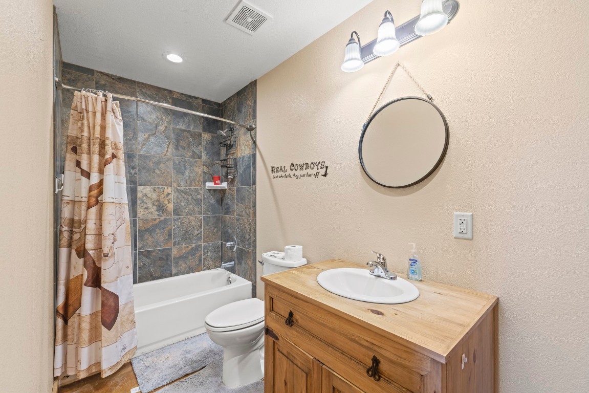 723 Fm 2926 Baird, TX 79504 - Photo 21 of 26 a bathroom with a granite countertop sink toilet and shower