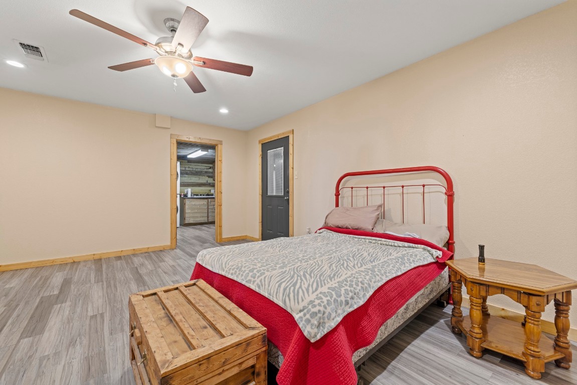 723 Fm 2926 Baird, TX 79504 - Photo 22 of 26 a bedroom with a bed a chandelier and dresser