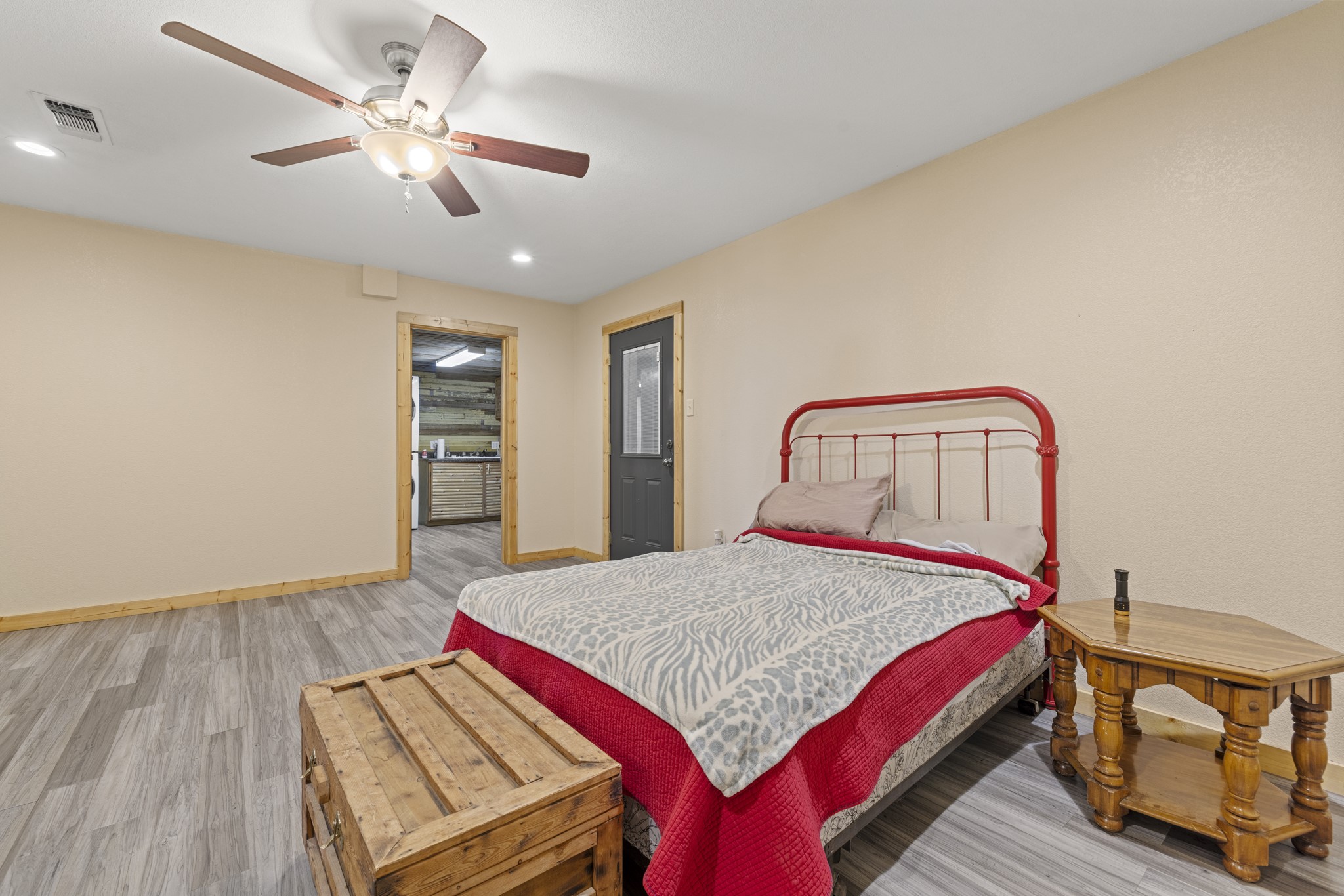 723 Fm 2926 Baird, TX 79504 - Photo 22 of 26 a bedroom with a bed a chandelier and dresser