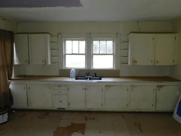 a room with granite countertop a sink and a granite top