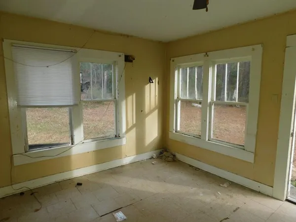 a view of an empty room and window