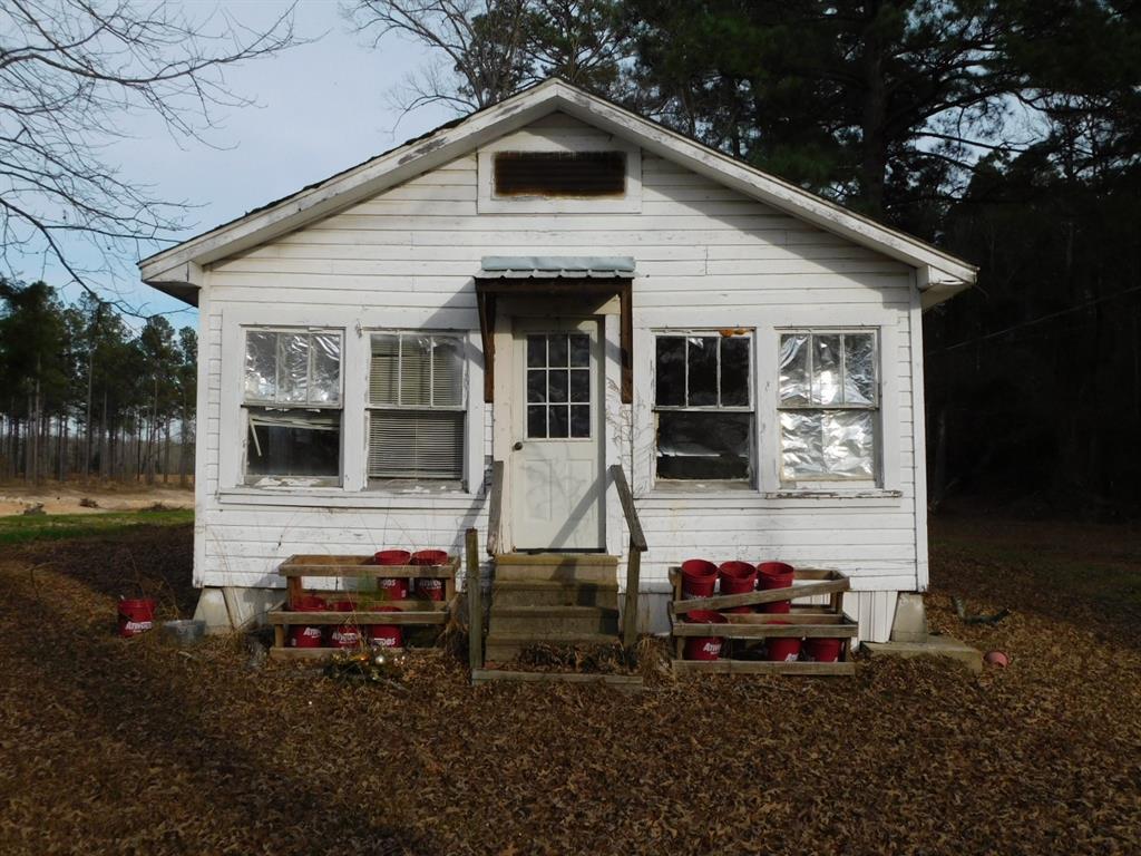 25707 Highway 371 Sarepta, LA 71071 - Photo 2 of 30 a view of a house with backyard sitting area and garden