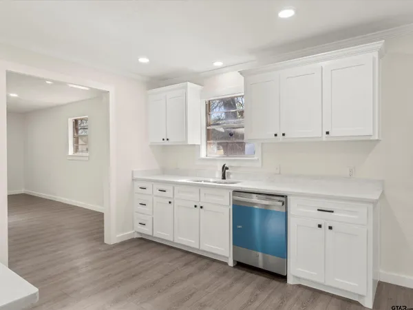 a kitchen with a stove and a microwave