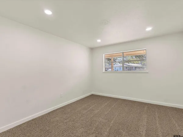 an empty room with a bench