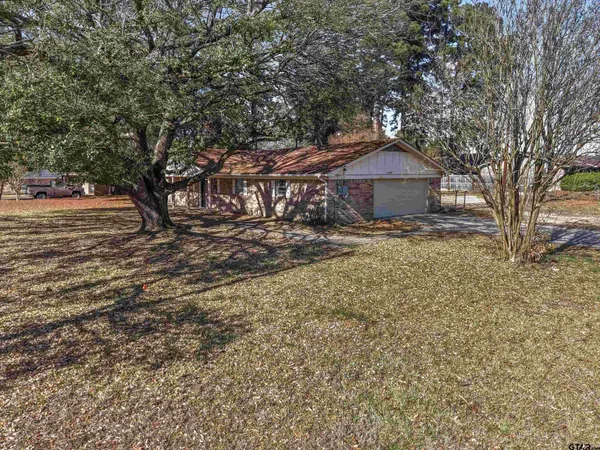 front view of a house with a trees