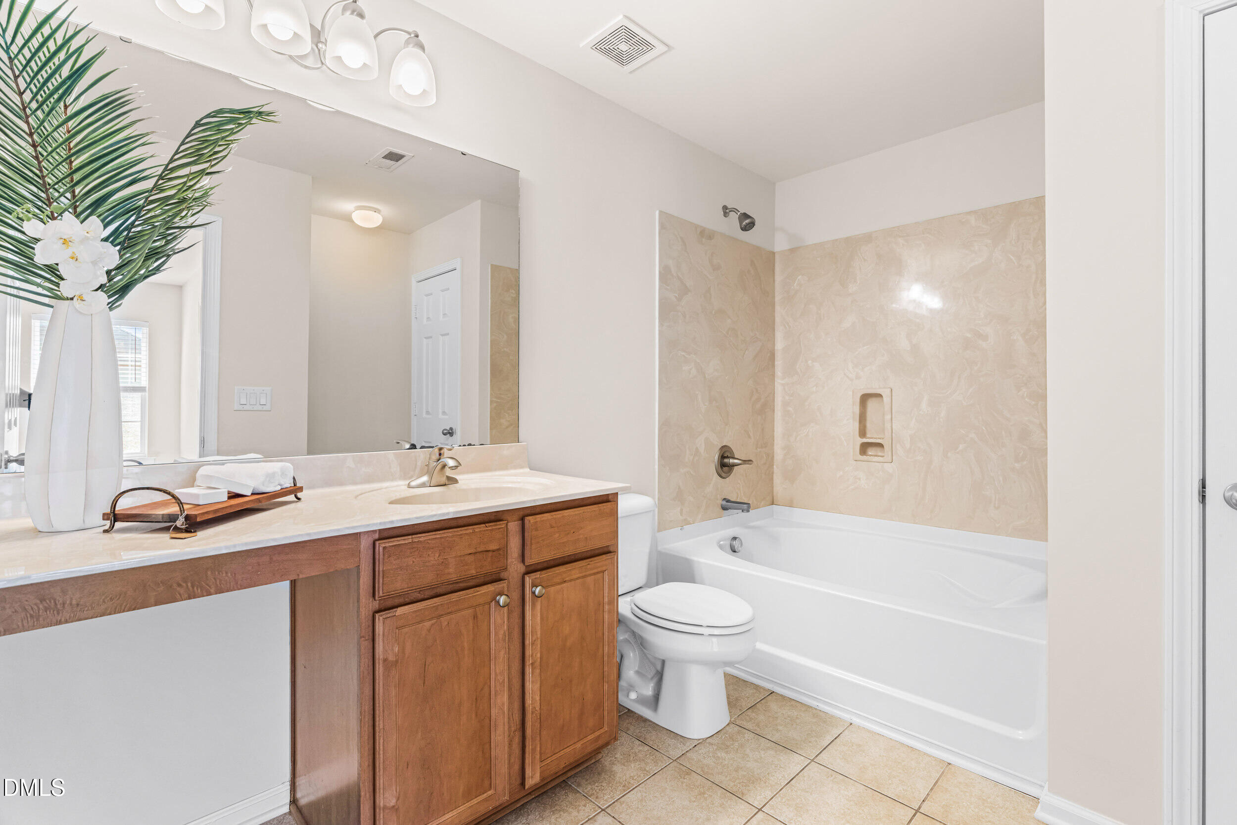 113 Cupp Court Raleigh, NC 27603 - Photo 15 of 29 a bathroom with a bathtub shower sink mirror and toilet