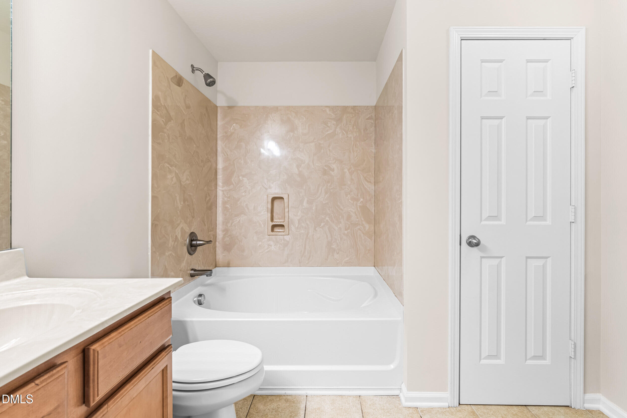 113 Cupp Court Raleigh, NC 27603 - Photo 16 of 29 a bathroom with a granite countertop bathtub shower sink vanity and toilet