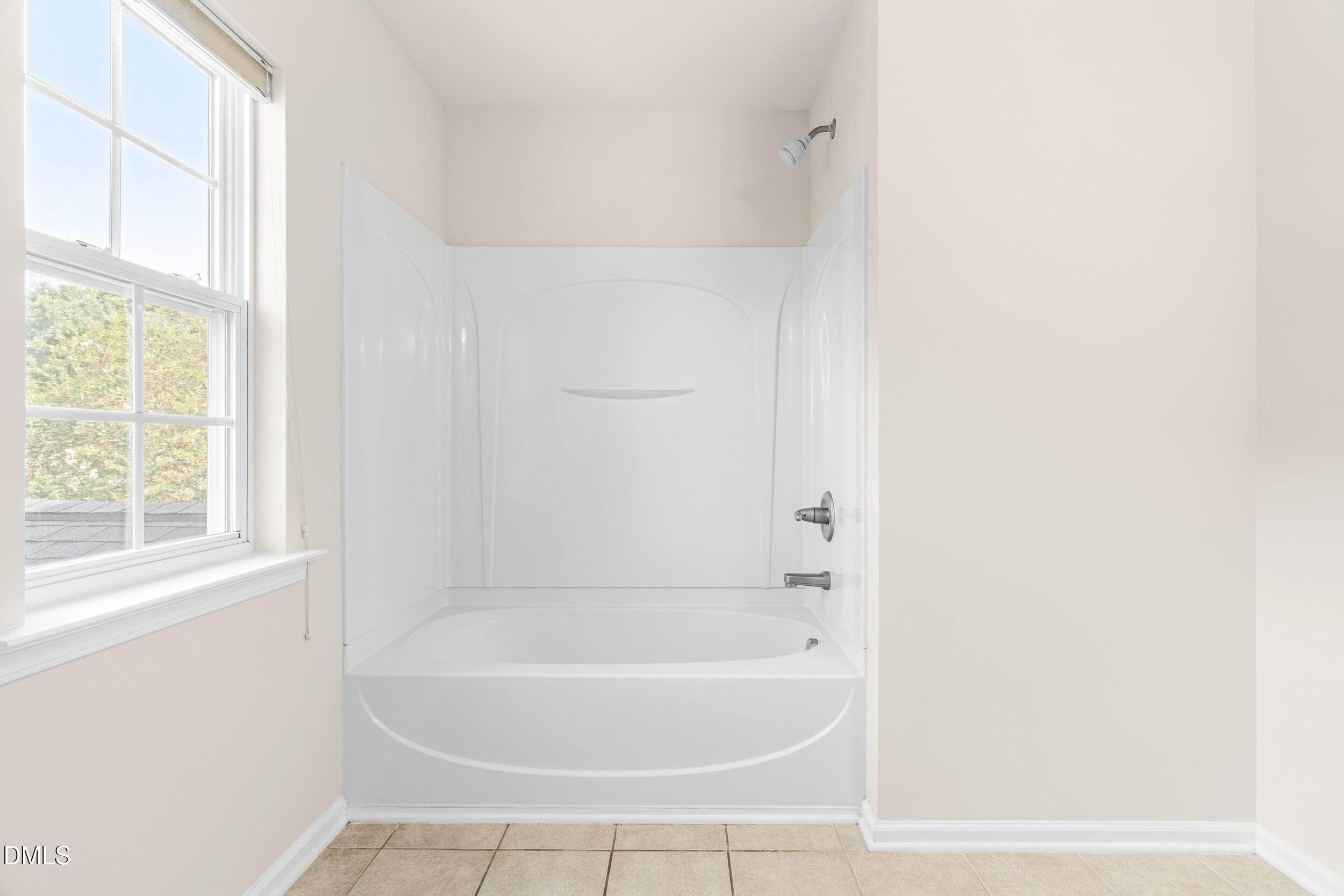 113 Cupp Court Raleigh, NC 27603 - Photo 21 of 29 a white bath tub sitting next to a window