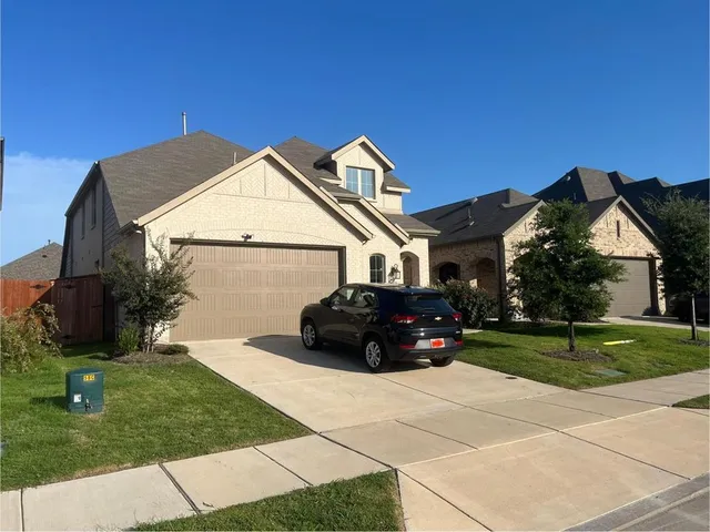 a house view with a garden space