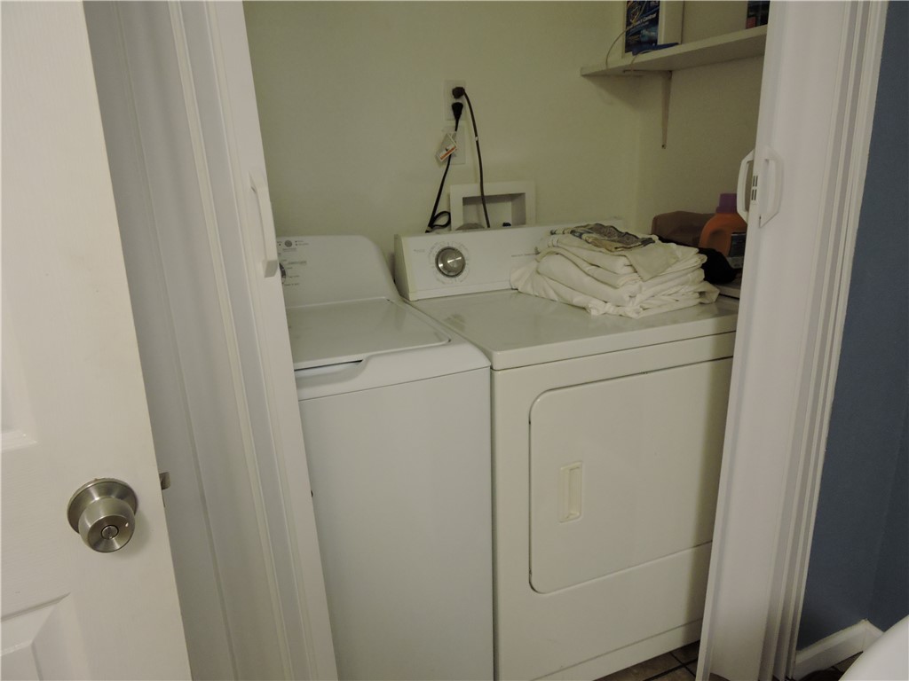 1901 Hattons Ford Road Townville, SC 29689 - Photo 15 of 33 A well-organized laundry closet features a full-size washer and dryer with convenient overhead shelving.