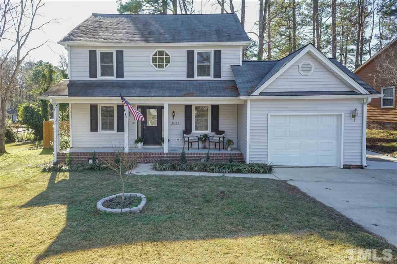 3628 Wickersham Way Raleigh, NC 27604 - Photo 1 of 21 a front view of a house with garden