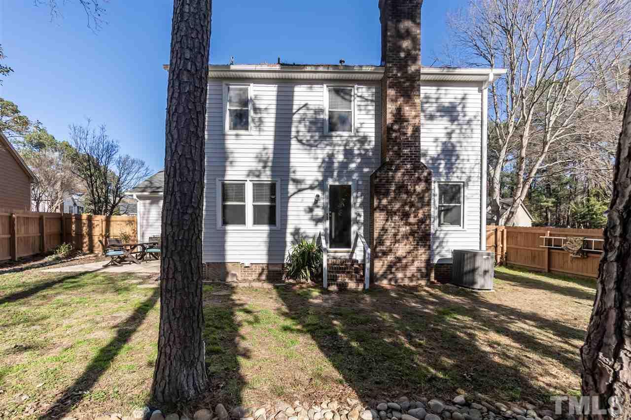 3628 Wickersham Way Raleigh, NC 27604 - Photo 21 of 21 a front view of a house with a yard outdoor seating and covered with snow