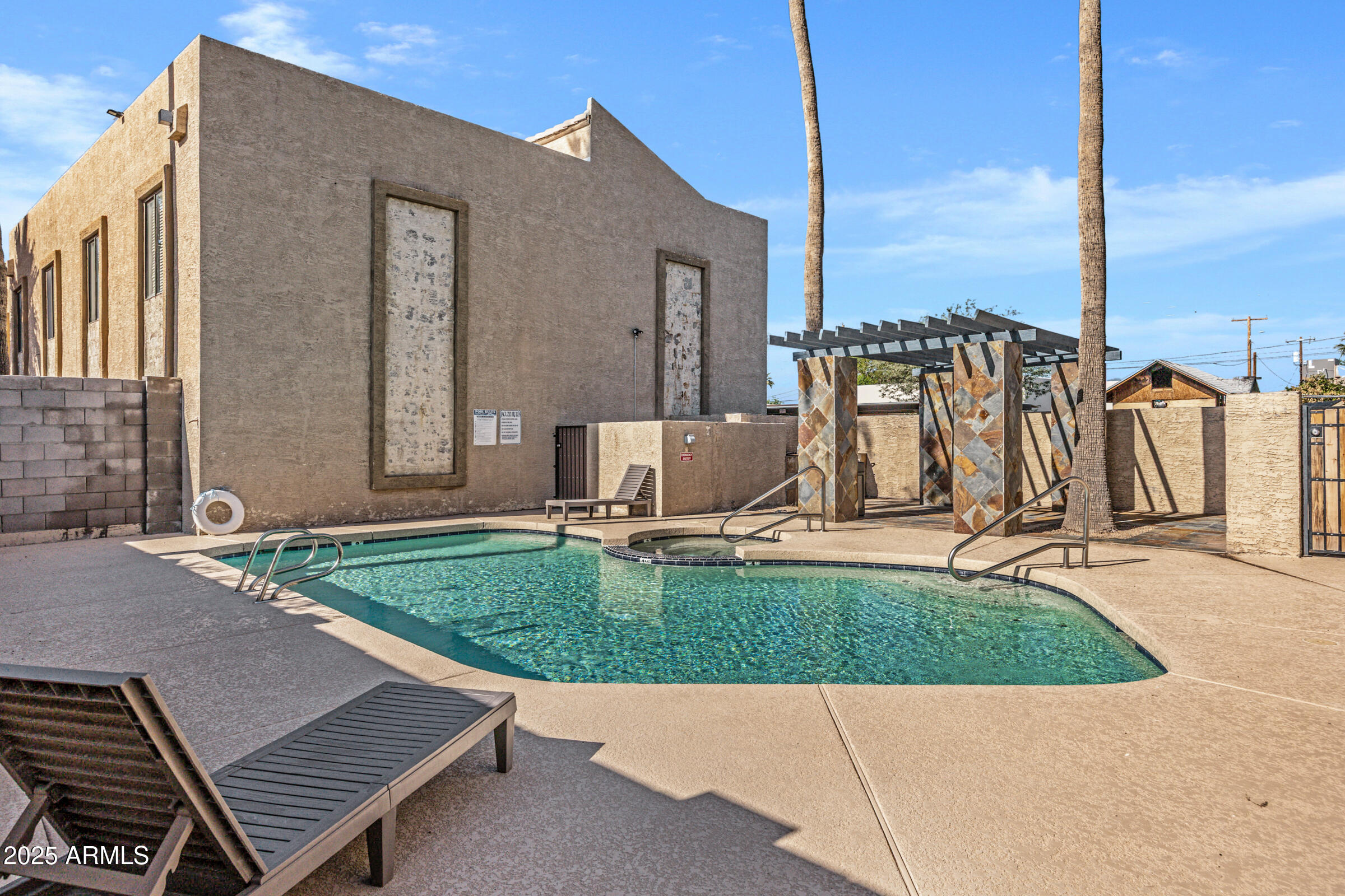 1241 North 48th Street, Unit 102 Phoenix, AZ 85008 - Photo 12 of 12 a view of a patio with a table and chairs