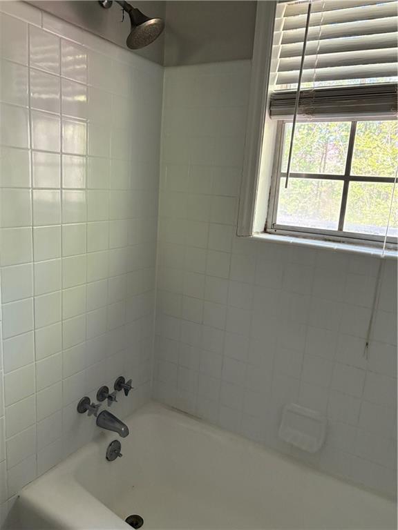 3211 Flamingo Drive East Point, GA 30344 - Photo 19 of 26 a bathroom with a window and a shower