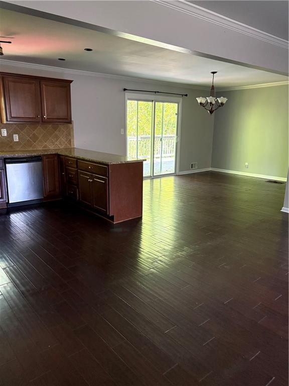 3211 Flamingo Drive East Point, GA 30344 - Photo 9 of 26 a kitchen with granite countertop a stove and a wooden floors