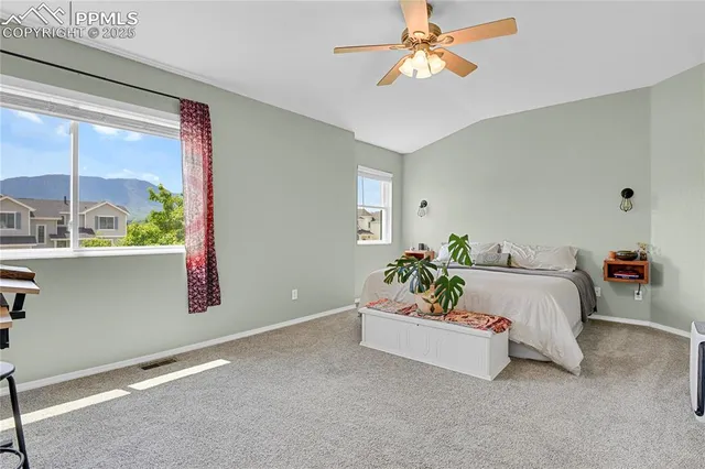 a bed room with a bed and a chandelier