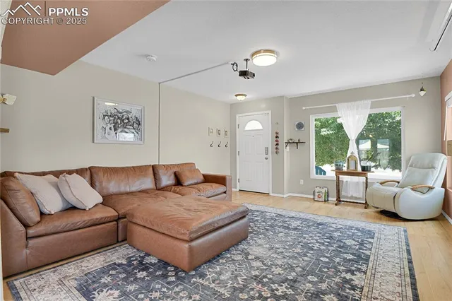 a living room with furniture and a rug