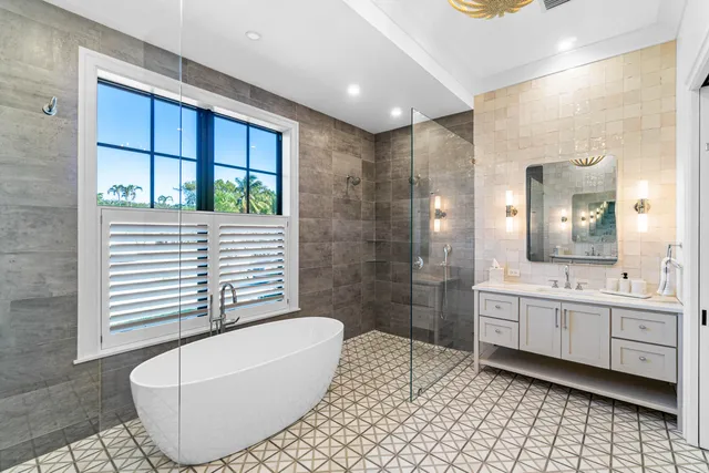 a bathroom with a bathtub and a shower